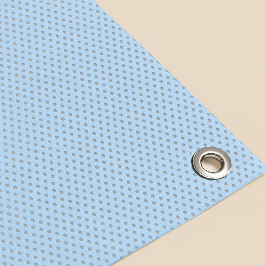 Blue perforated sheet with a metal eyelet on a beige background