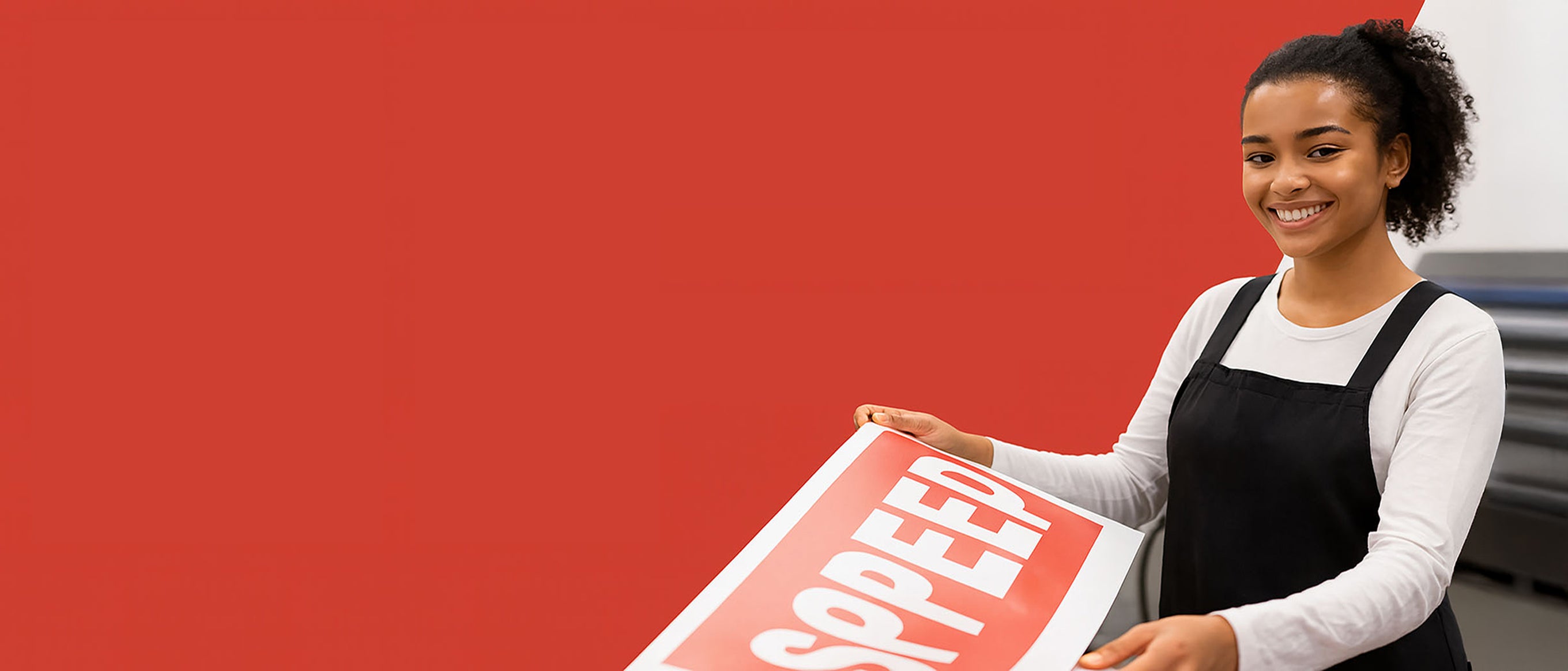 Person holding a 'Speed' sign against a red background