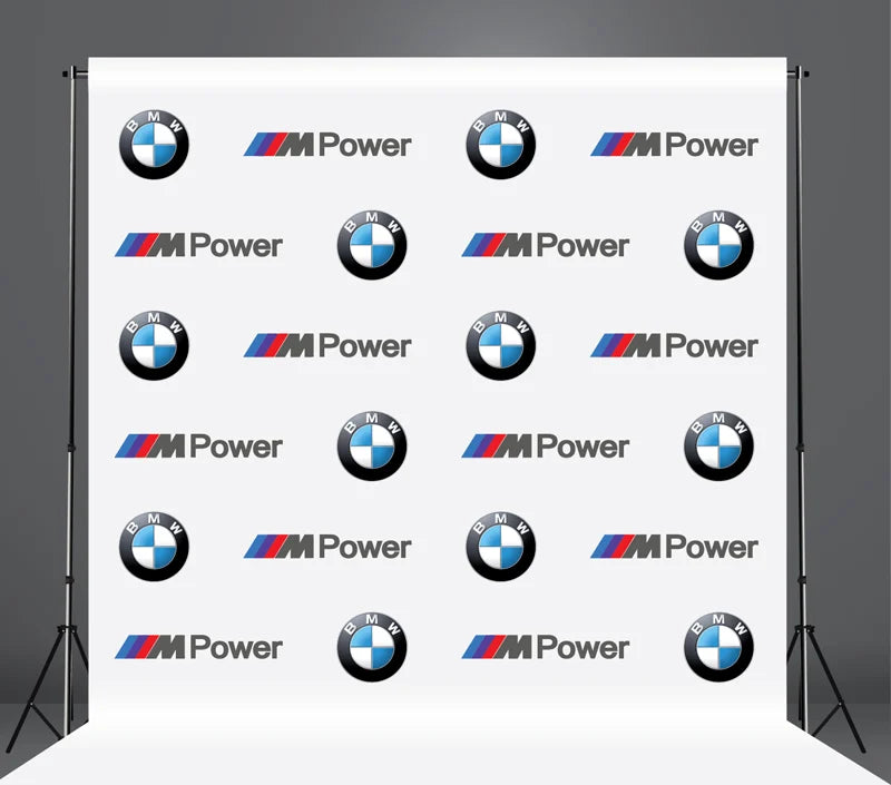 Backdrop with BMW M Power logos on a gray background