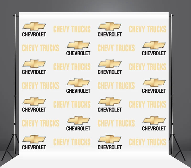 Chevy Trucks promotional backdrop with logos on a white background