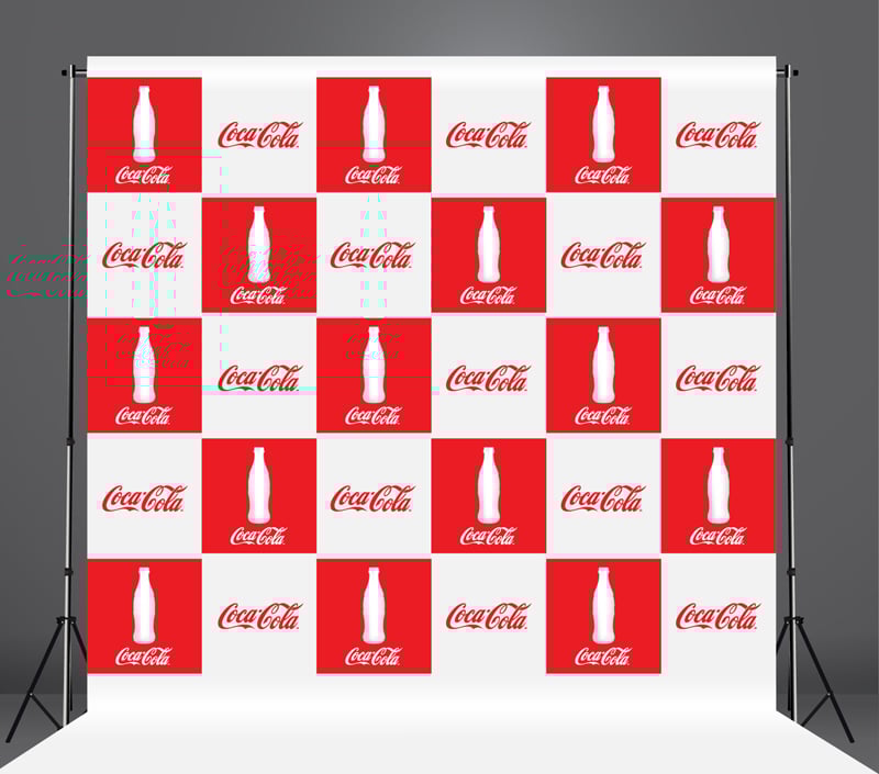 Coca-Cola branded backdrop with red and white squares featuring the brand logo and bottle icon.